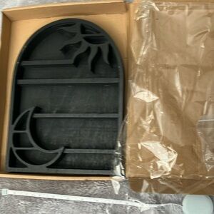 Little wall mounted wooden shelf.  Cute. View images for size. New in Box